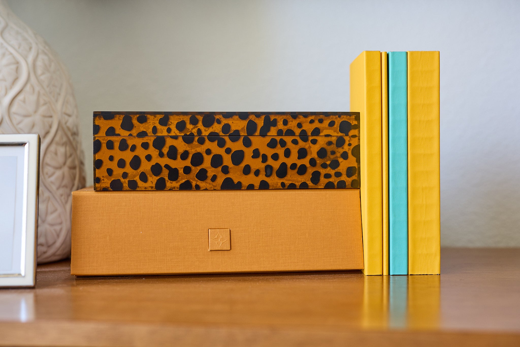 A stack of A Lovely Everyday notebooks and boxes.